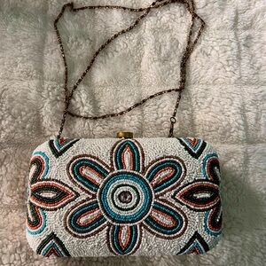 Cato’s floral beaded clutch with gold chain